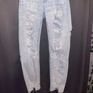 Woman’s ripped light wash jeans